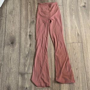 Lululemon nulu groove pants with some damage to the bottom of the legs
